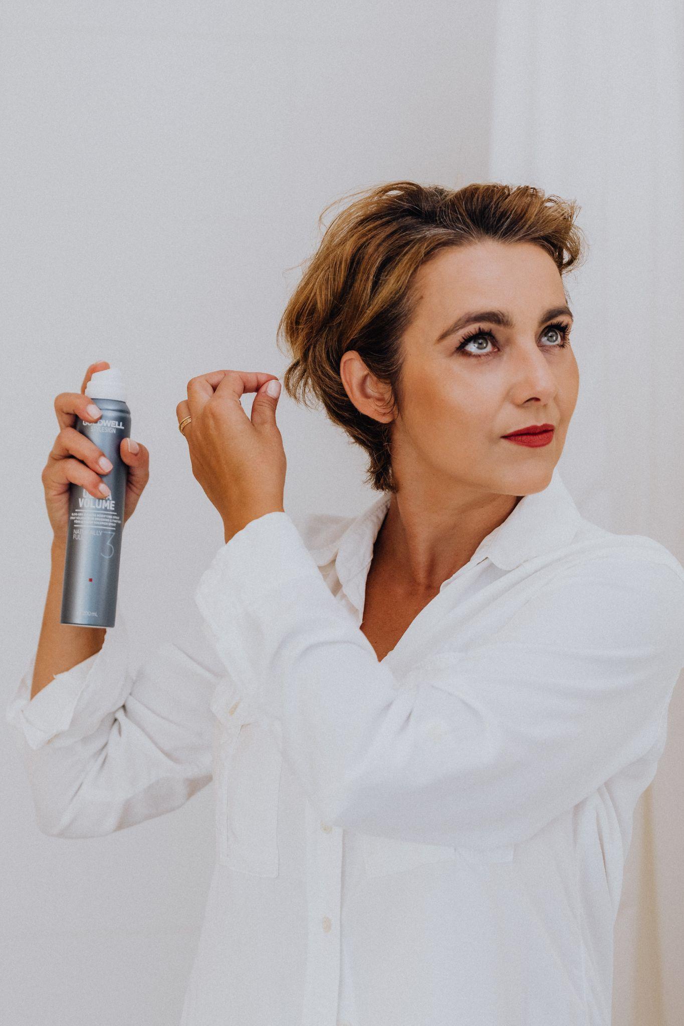 Woman using Hair spray