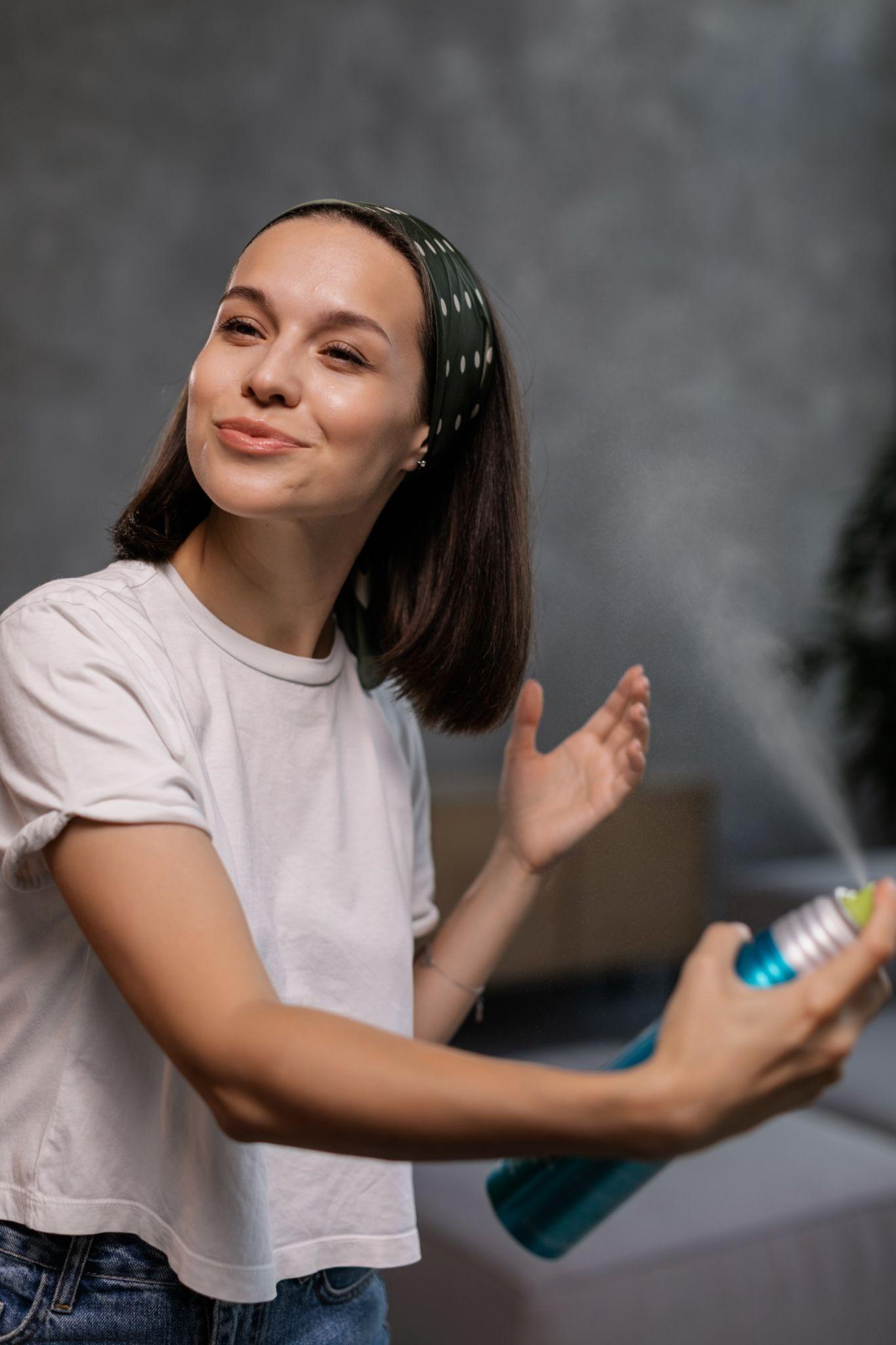 Hair spray on woman